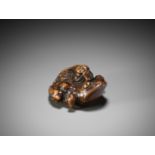 SHUYA: A WOOD NETSUKE OF GAMA SENNIN ON A TOAD