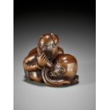 A FINE EDO SCHOOL WOOD NETSUKE OF ARIOMARU STRUGGLING WITH AN OCTOPUS