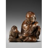 HOKYUDO ITSUMIN: A SUPERB WOOD NETSUKE OF A SARUMAWASHI AND MONKEY