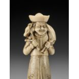 A SUPERB IVORY NETSUKE OF A DUTCHMAN