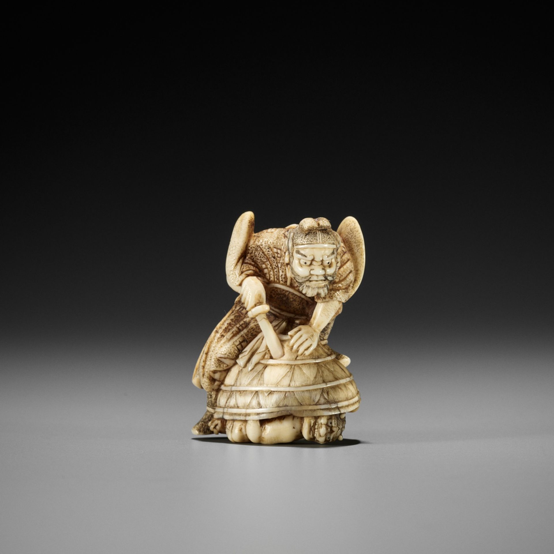 HIDEMASA: AN AMUSING IVORY NETSUKE OF SHOKI AND ONI