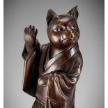 SHOKO SUGONOYA: A RARE AND FINE WOOD OKIMONO OF A CAT GEISHA