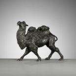 KAKUHA: A FINE BRONZE OKIMONO OF A STRIDING BACTRIAN CAMEL