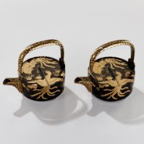 A PAIR OF BLACK AND GOLD LACQUER CHOSHI (SAKE EWERS) AND COVERS