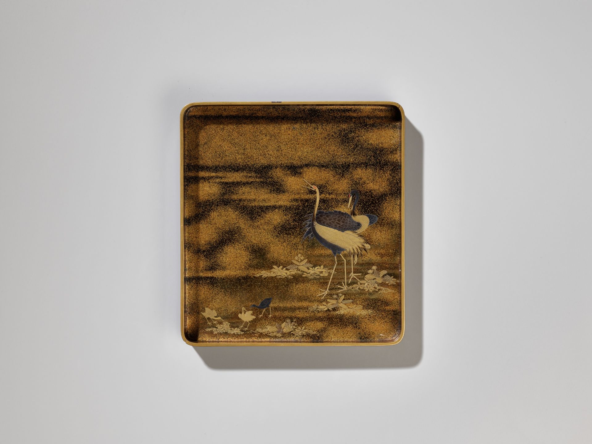 A BLACK AND GOLD LACQUER SUZURIBAKO WITH A SHORELINE LANDSCAPE AND RED-CRESTED CRANES - Image 2 of 15