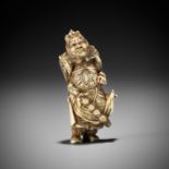 A GOOD STAG ANTLER NETSUKE OF KAN'U