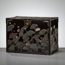 A RITSUO STYLE CERAMIC-INLAID AND LACQUERED WOOD KODANSU (CABINET) WITH A LOTUS POND AND EGRETS