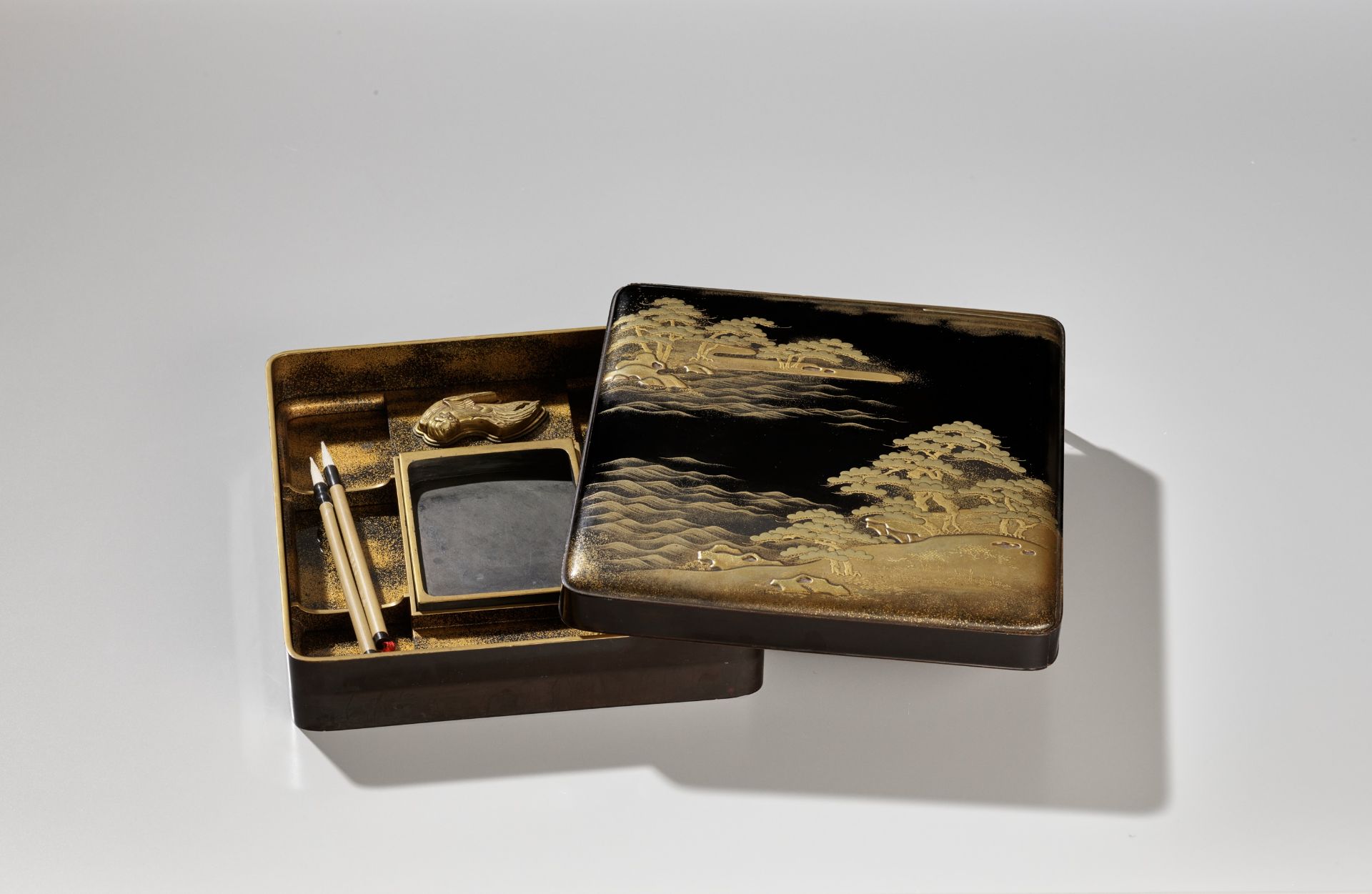 A BLACK AND GOLD LACQUER SUZURIBAKO WITH A SHORELINE LANDSCAPE AND RED-CRESTED CRANES - Image 13 of 15