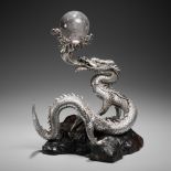 SANMI: A MASTERFUL SILVER OKIMONO OF A DRAGON WITH ROCK CRYSTAL SPHERE