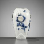 A MOLDED AND CARVED HIRADO BLUE AND WHITE VASE WITH CHRYSANTHEMUMS AND BUTTERFLIES