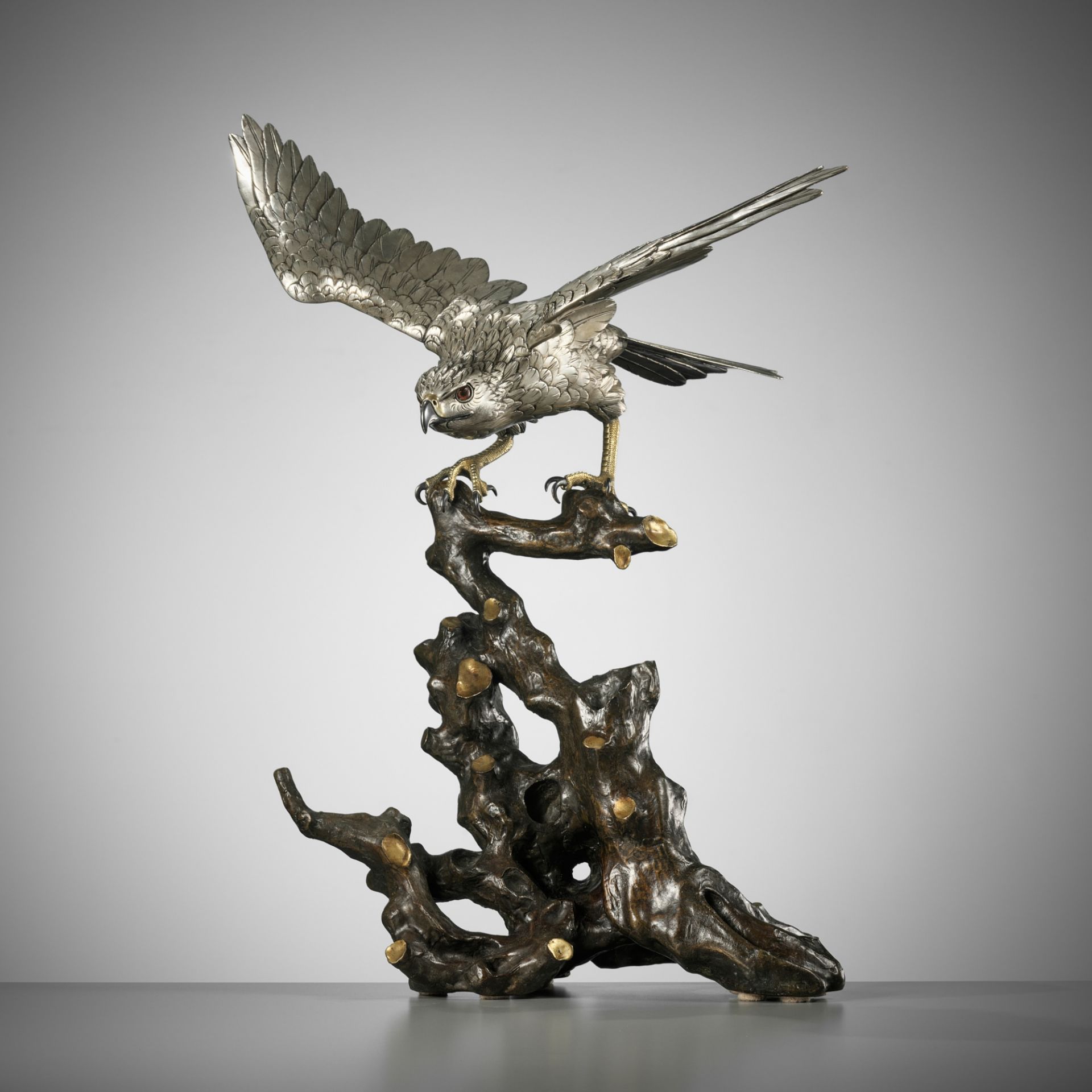 HANEHIRO: A FINE SILVERED BRONZE OKIMONO OF A HAWK