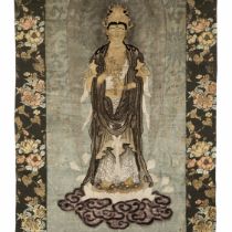 A RARE EMBROIDERED SILK WALL HANGING OF KANNON