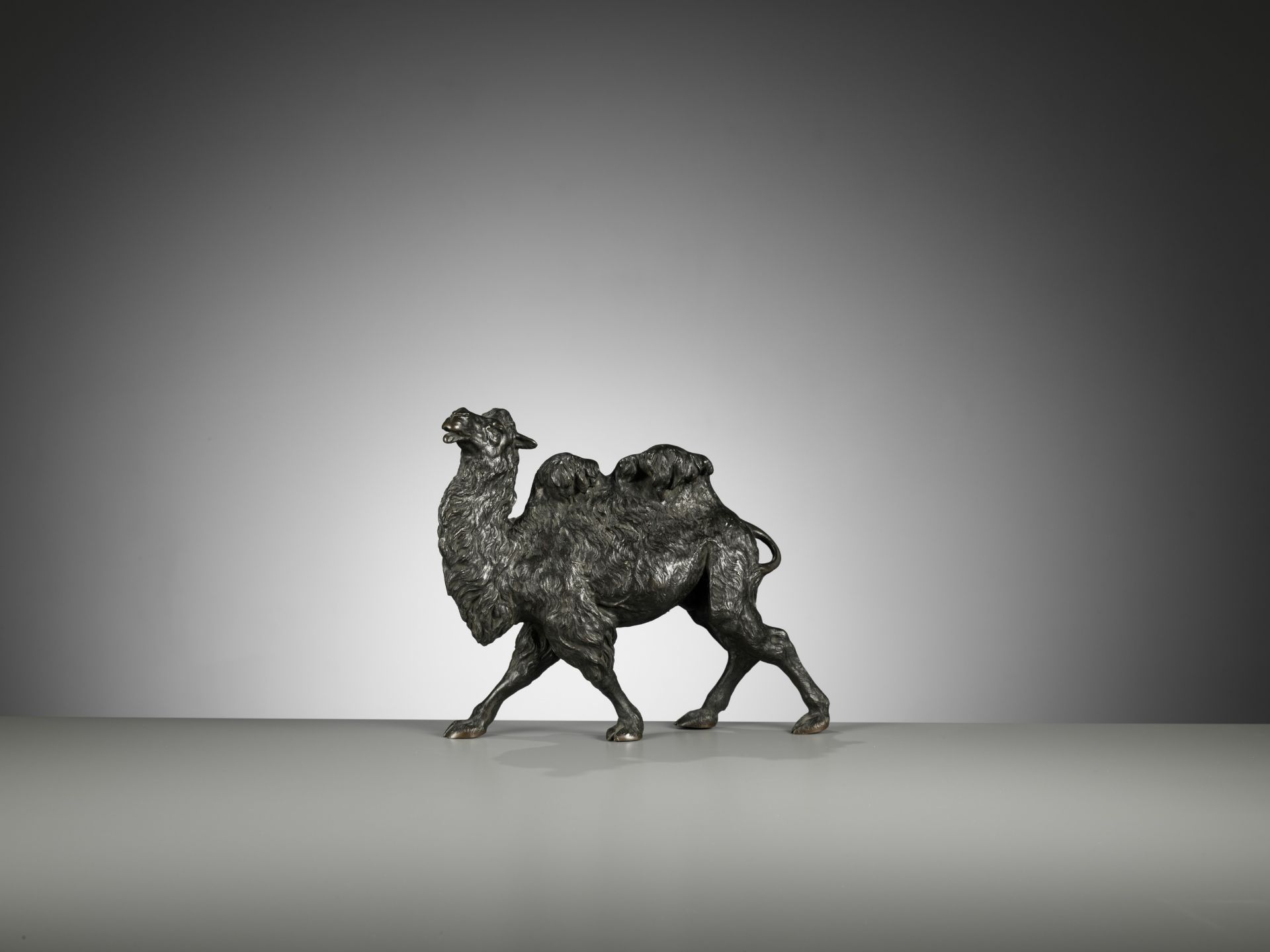 KAKUHA: A FINE BRONZE OKIMONO OF A STRIDING BACTRIAN CAMEL - Image 2 of 11