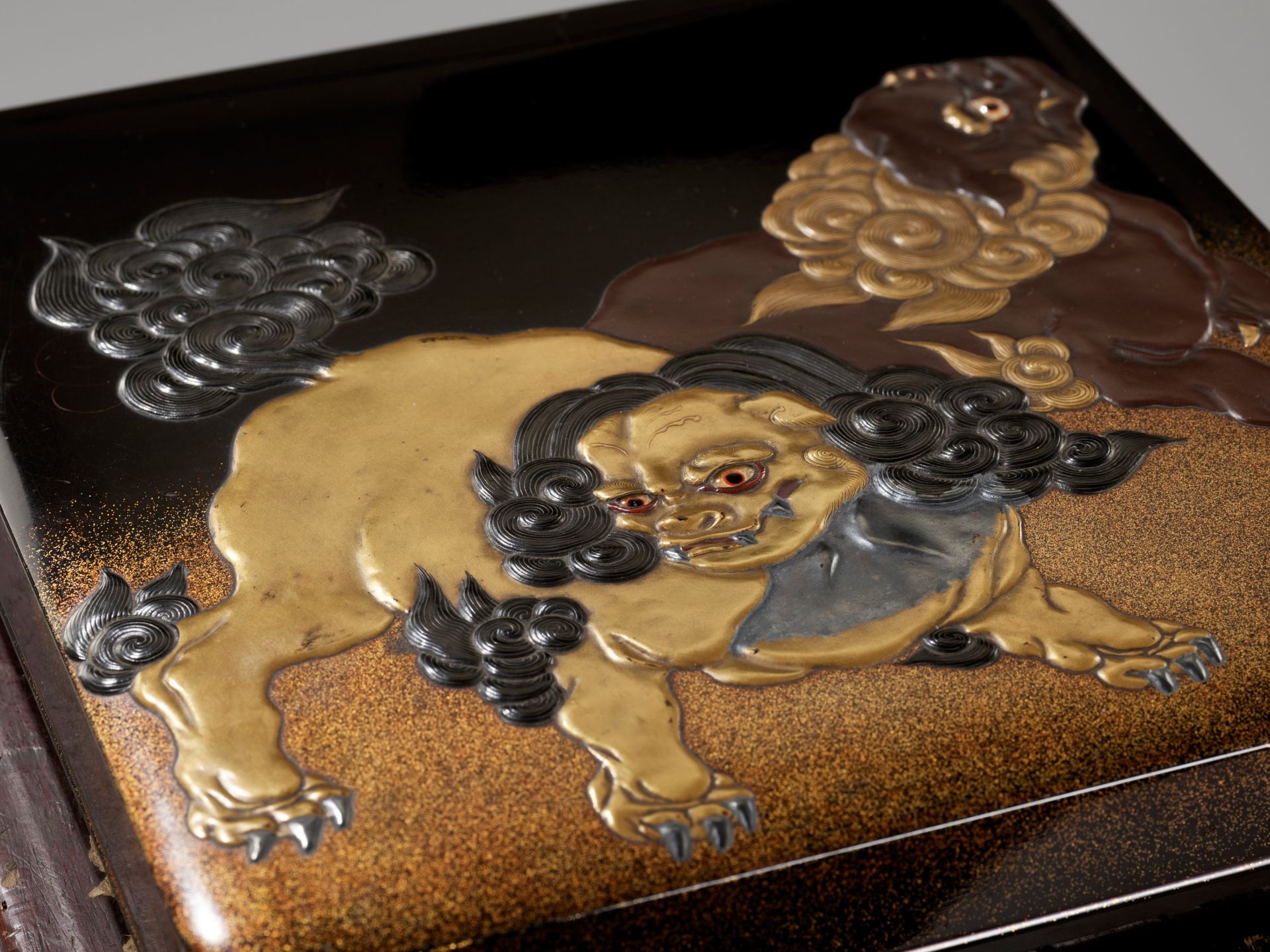 A LACQUER SUZURIBAKO DEPICTING SHISHI AND HOTEI - Image 2 of 11