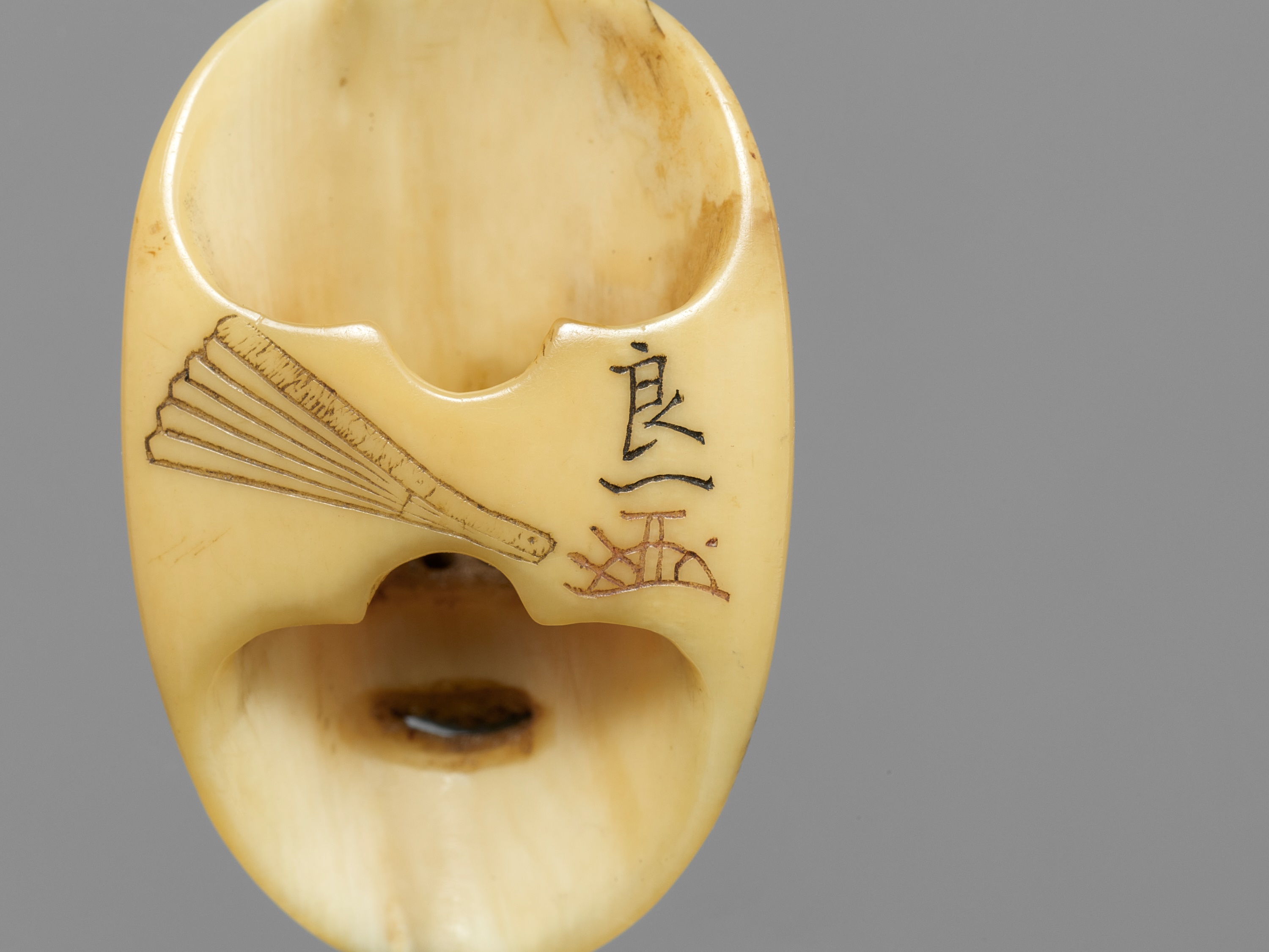 RYOICHI: A MARINE IVORY NETSUKE OF A NOH MASK, KO-OMOTE - Image 10 of 10