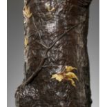 A MASTERFUL PARCEL-GILT BRONZE VASE DEPICTING A TREE TRUNK WITH AUTUMN LEAVES