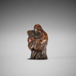 ROKKO: A FINE WOOD NETSUKE OF JUROJIN