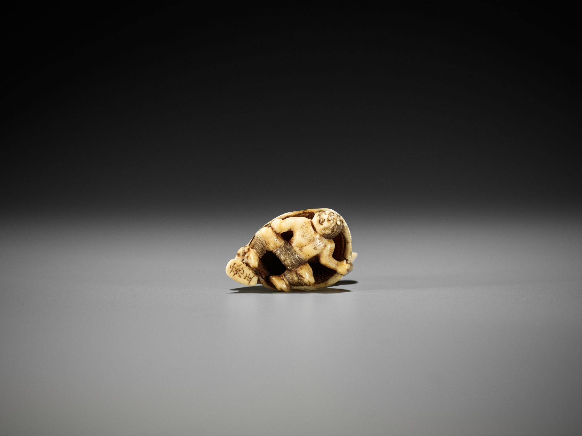 HIDEMASA: AN AMUSING IVORY NETSUKE OF SHOKI AND ONI - Image 2 of 10