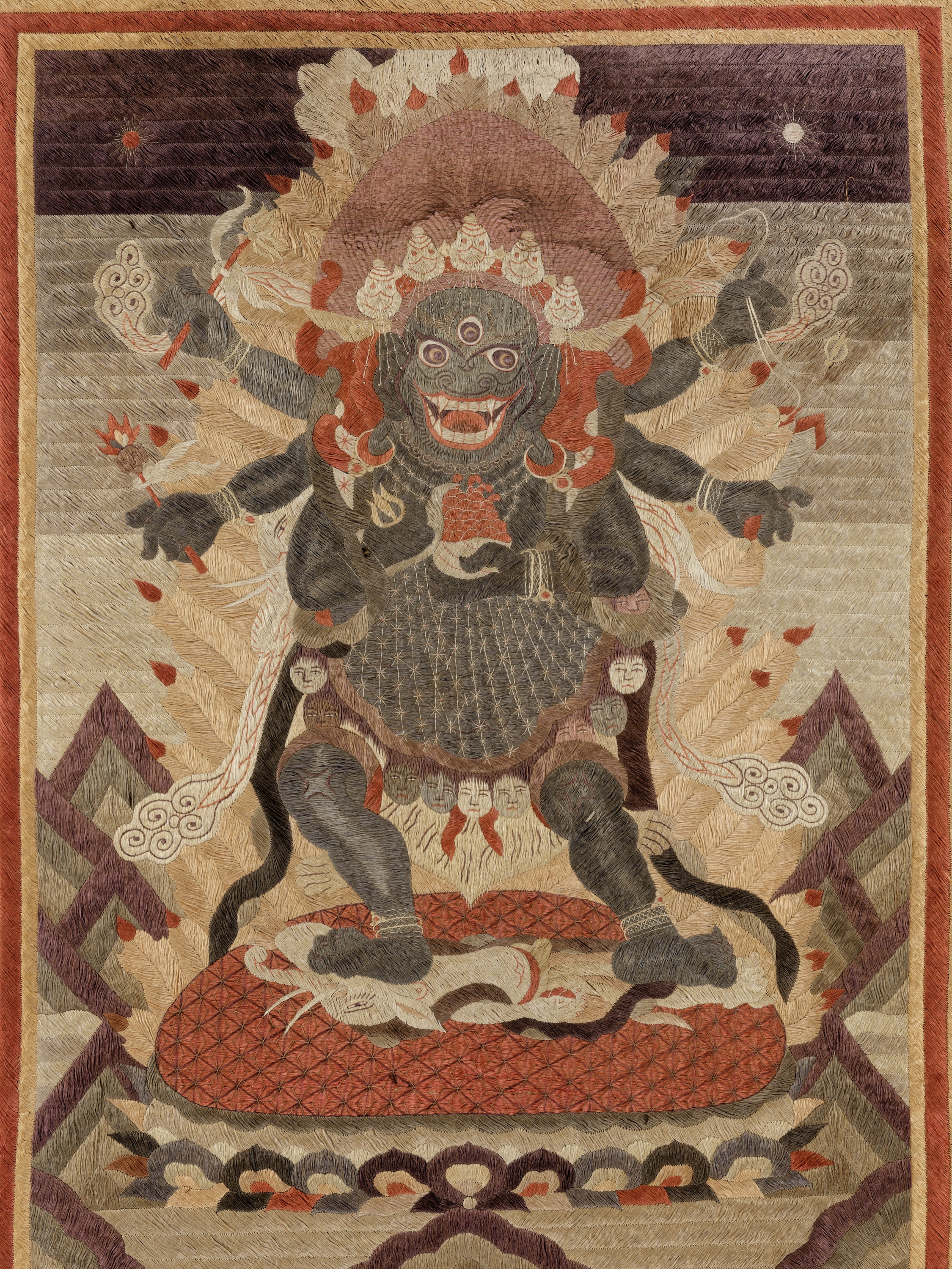 AN IMPRESSIVE SILK EMBROIDERED THANGKA OF MAHAKALA