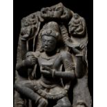 A LARGE AND EXCEPTIONAL GRAY SCHIST STATUE OF A DANCING SHIVA, EARLY MALLA DYNASTIES