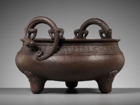 A LARGE ARCHAISTIC CAST IRON TRIPOD CENSER, MING DYNASTY