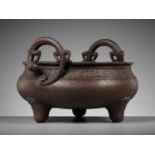 A LARGE ARCHAISTIC CAST IRON TRIPOD CENSER, MING DYNASTY