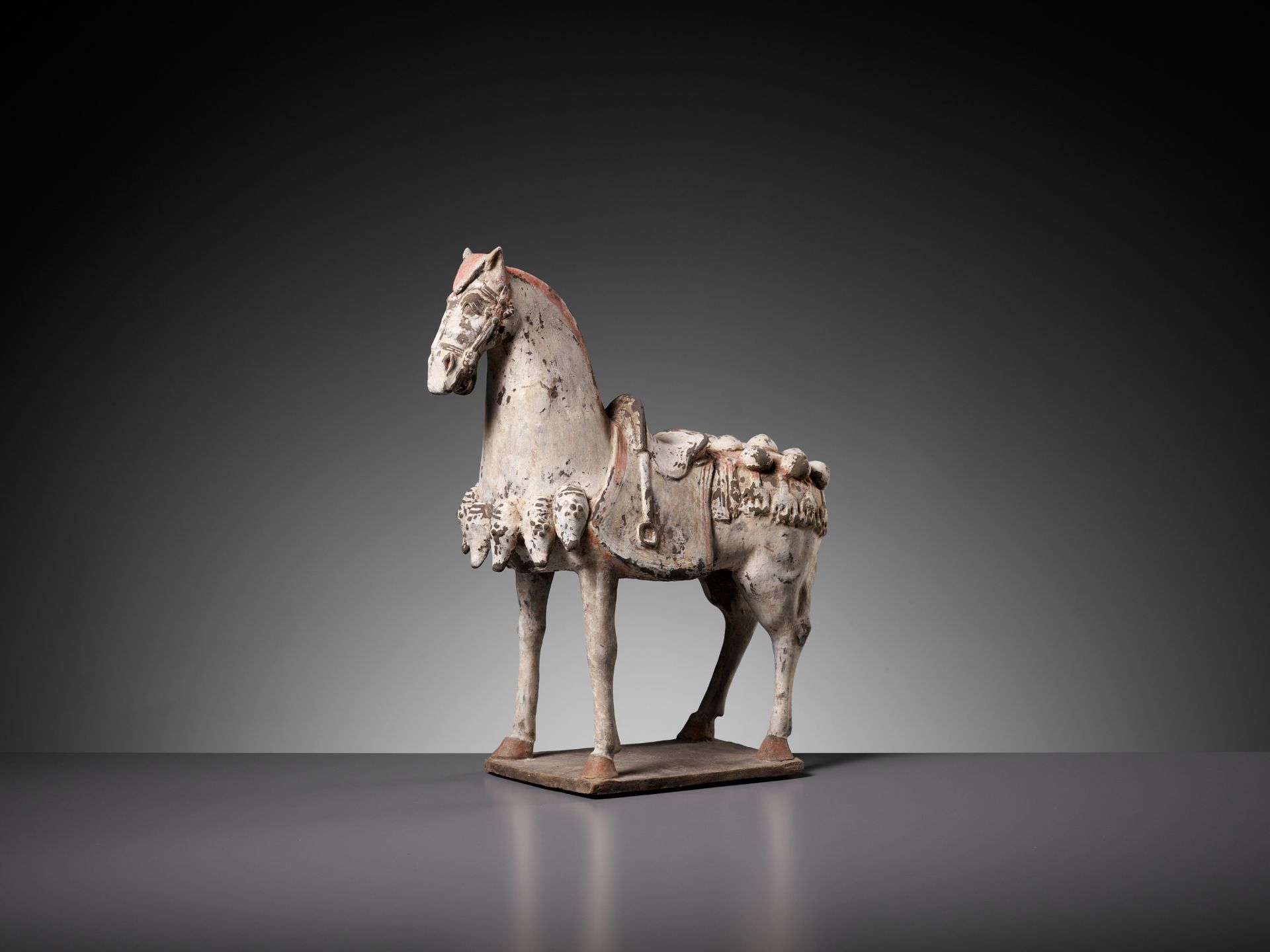 A PAINTED POTTERY FIGURE OF A CAPARISONED HORSE, EASTERN WEI DYNASTY - Image 2 of 9