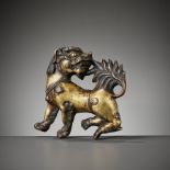 A MASSIVE GILT BRONZE RELIEF OF A BUDDHIST LION, 17TH-18TH CENTURY