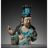 A LARGE AND MASSIVE FAHUA-GLAZED STONEWARE BUST OF GUANYIN, MING DYNASTY