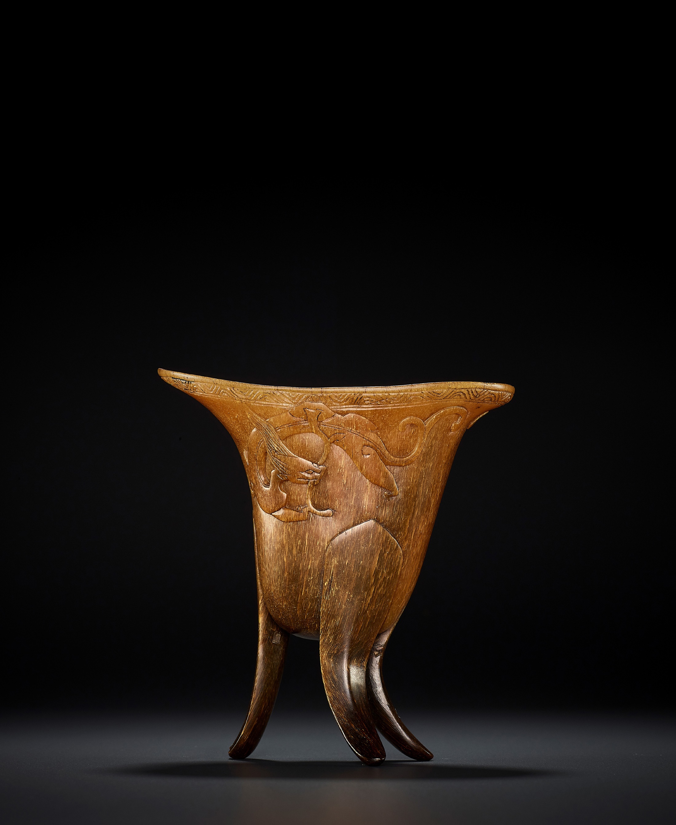 A RHINOCEROS HORN ARCHAISTIC LIBATION CUP, JUE, EARLY QING DYNASTY