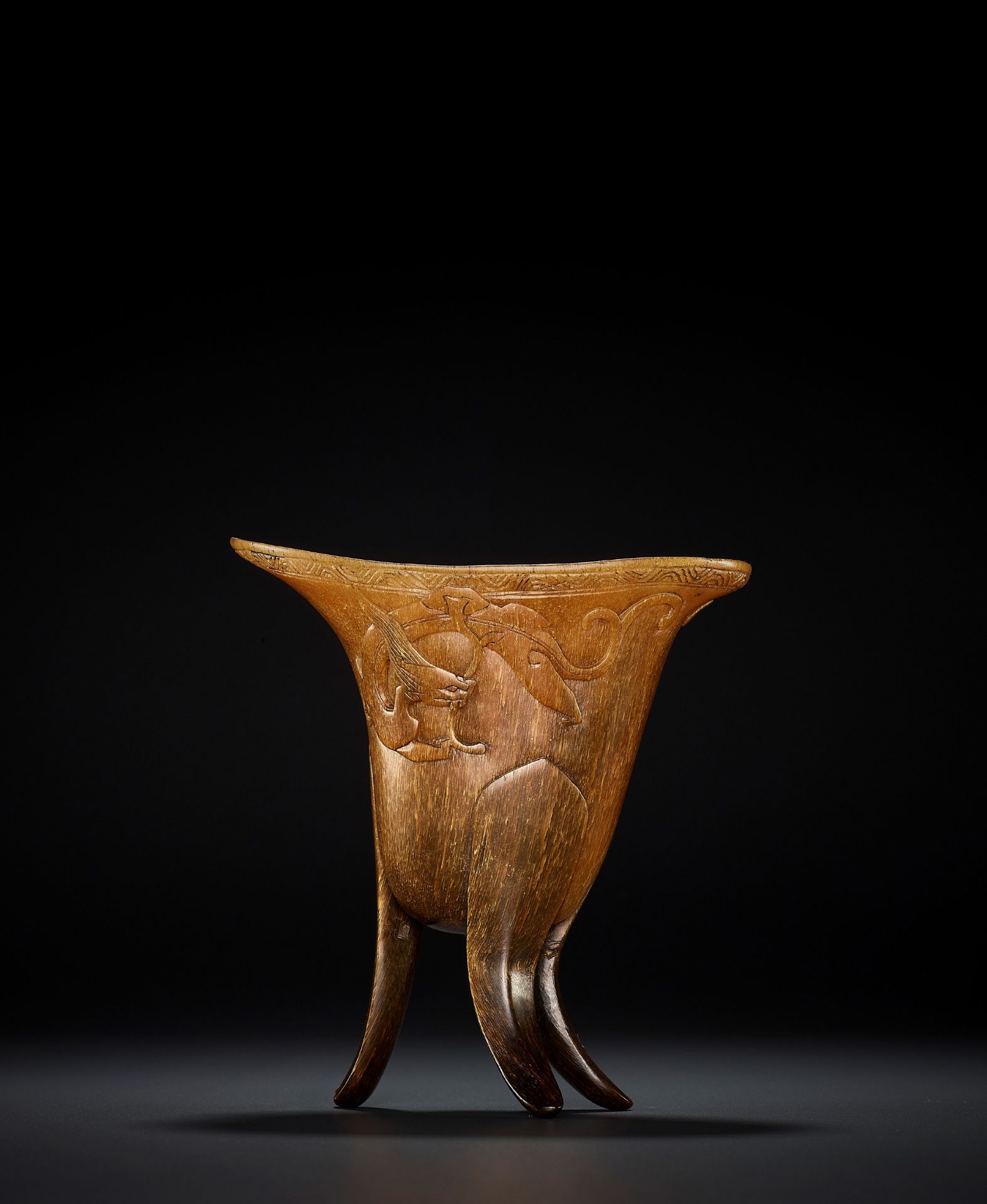 A RHINOCEROS HORN ARCHAISTIC LIBATION CUP, JUE, EARLY QING DYNASTY