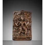 A CEREMONIAL COPPER SHIELD DEPICTING VIRABHADRA, 17TH-18TH CENTURY