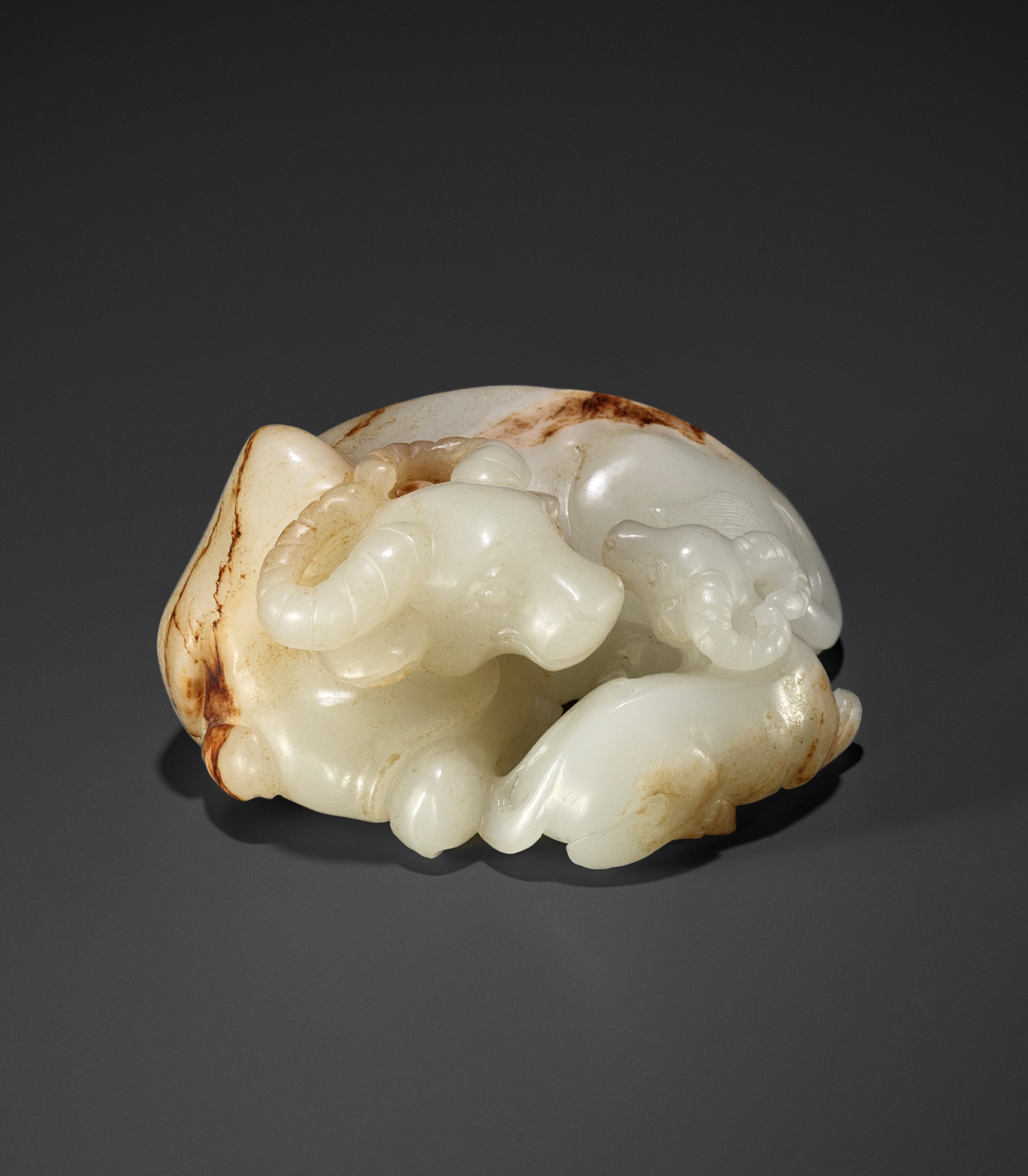 A WHITE AND RUSSET JADE GROUP OF A WATER BUFFALO AND A CALF, 18TH - 19TH CENTURY
