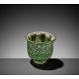 A RARE GREEN-GLAZED BELL-SHAPED CUP, TANG DYNASTY