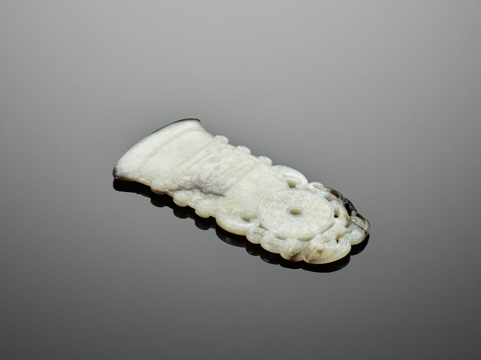 A BLACK AND WHITE JADE 'ARCHAISTIC' AXE-FORM OPENWORK PENDANT, 18TH CENTURY - Image 7 of 9