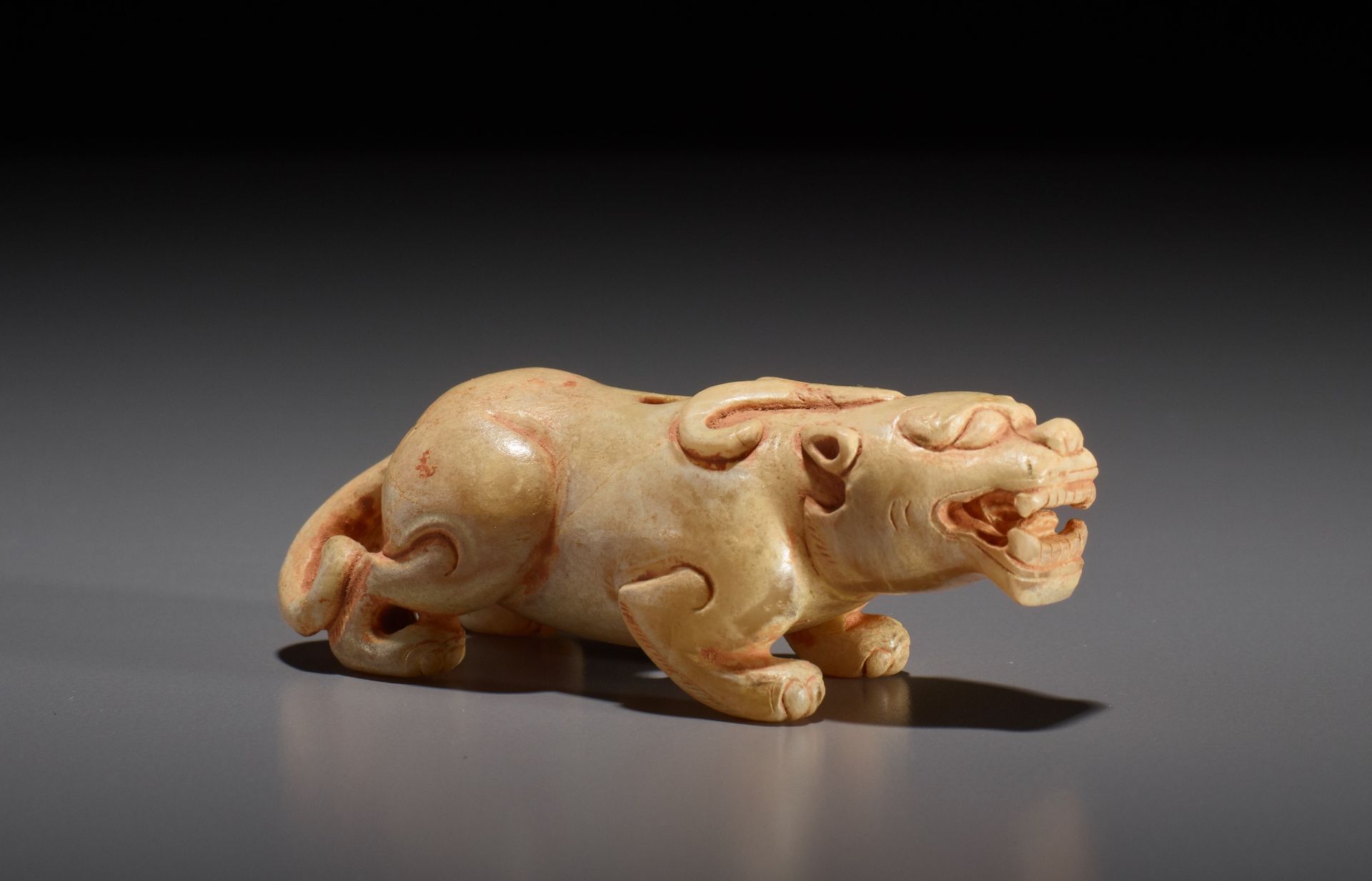 A SMALL JADE FIGURE OF A BIXIE, SIX DYNASTIES