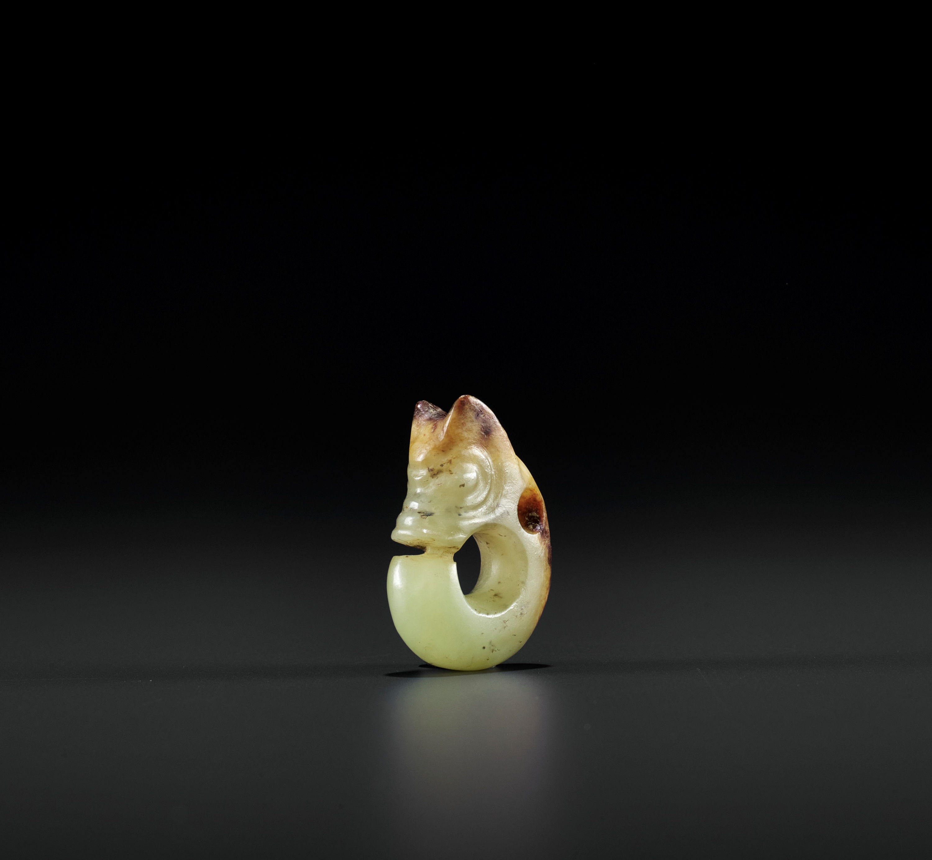 A YELLOW AND RUSSET MINIATURE 'PIG DRAGON' PENDANT, ZHULONG, MING DYNASTY