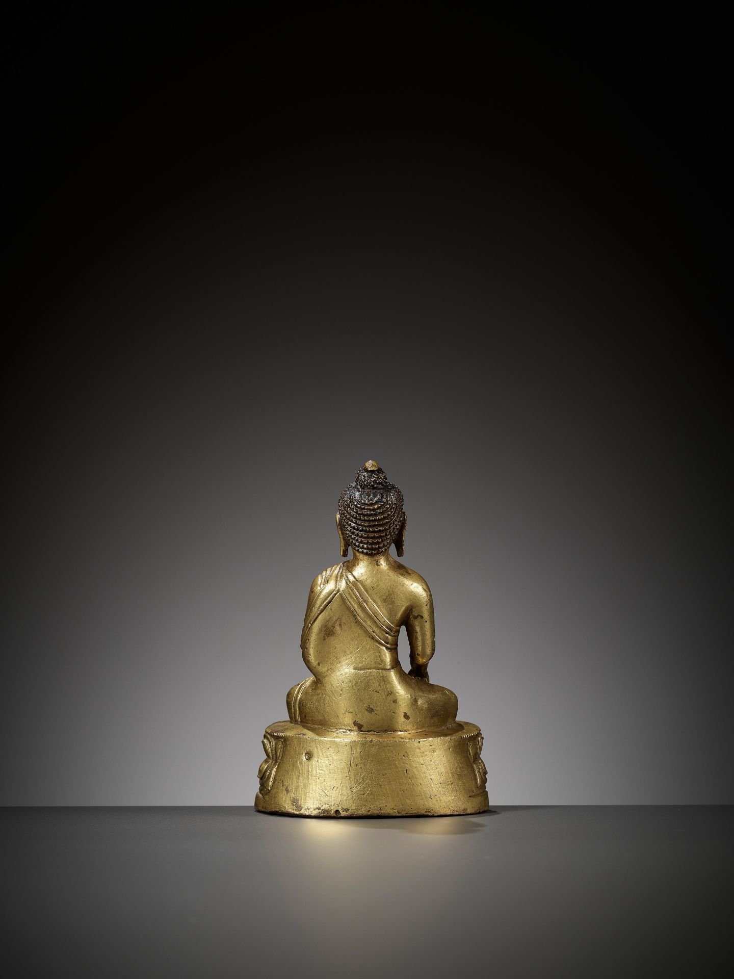 A GILT BRONZE FIGURE OF RATNASAMBHAVA, TIBET, 18TH CENTURY - Image 9 of 10