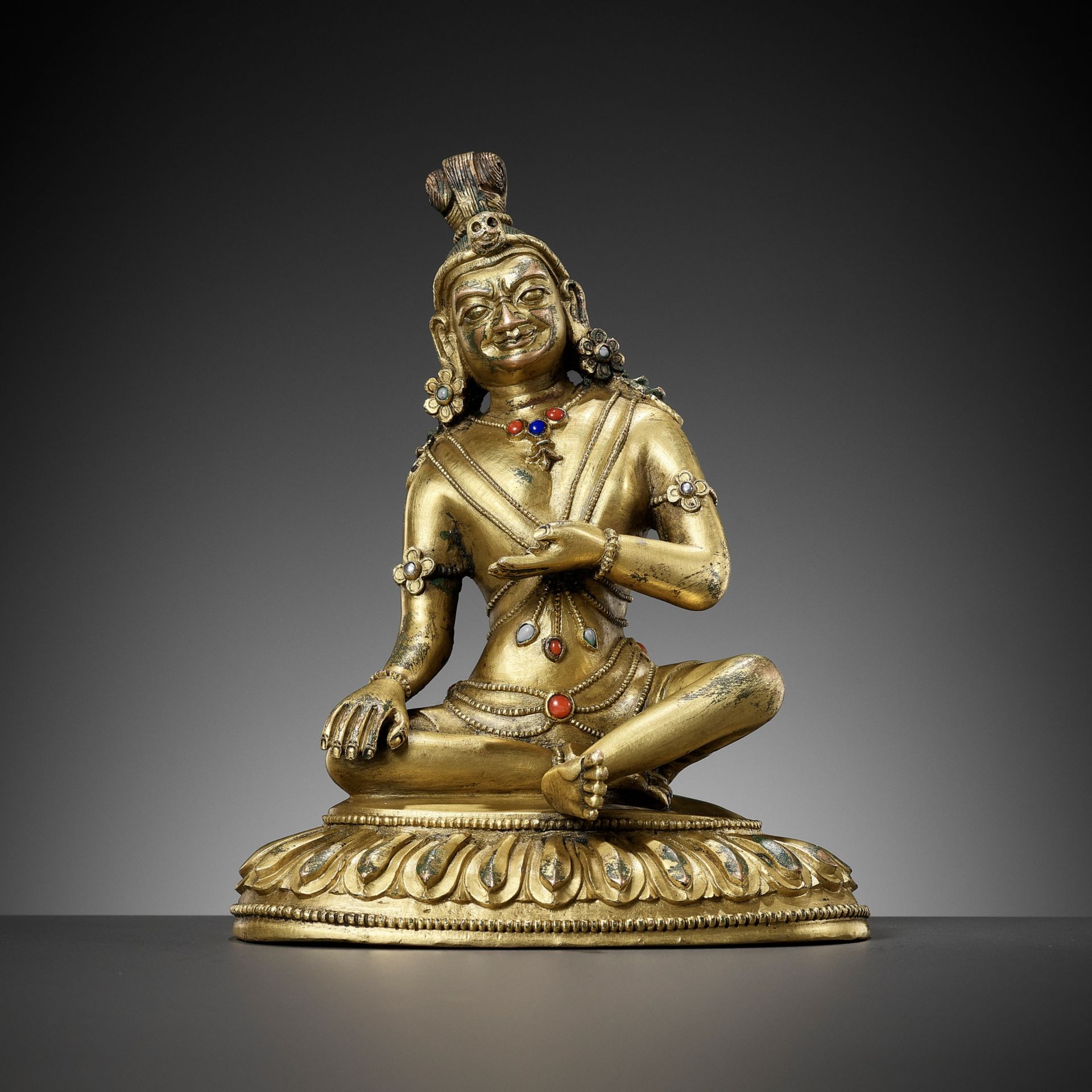 A BRONZE FIGURE OF A MAHASIDDHA