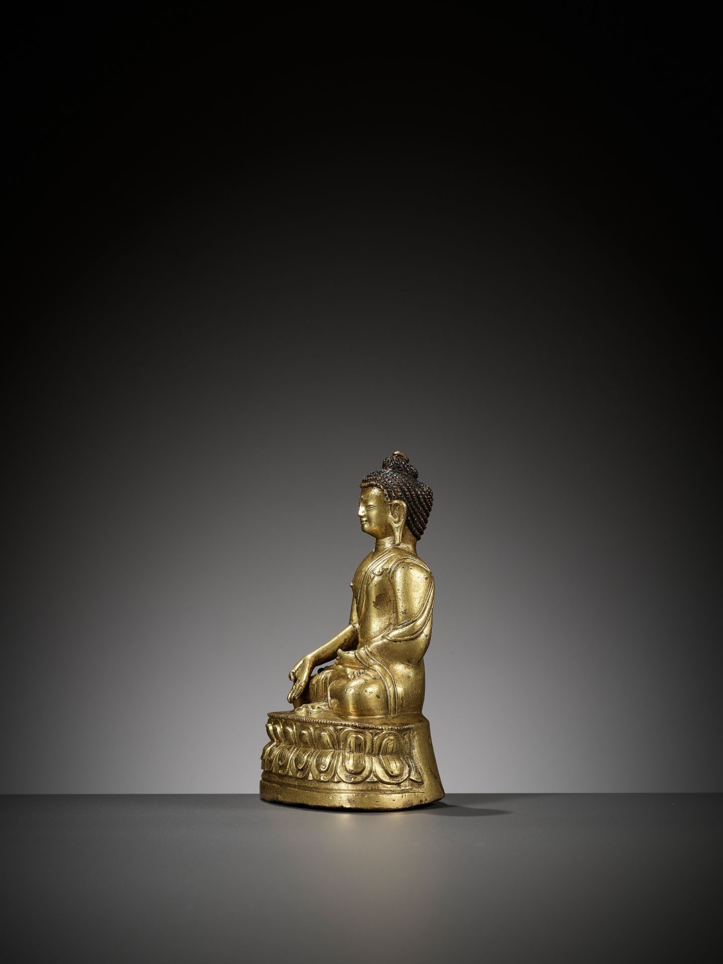 A GILT BRONZE FIGURE OF RATNASAMBHAVA, TIBET, 18TH CENTURY - Image 8 of 10