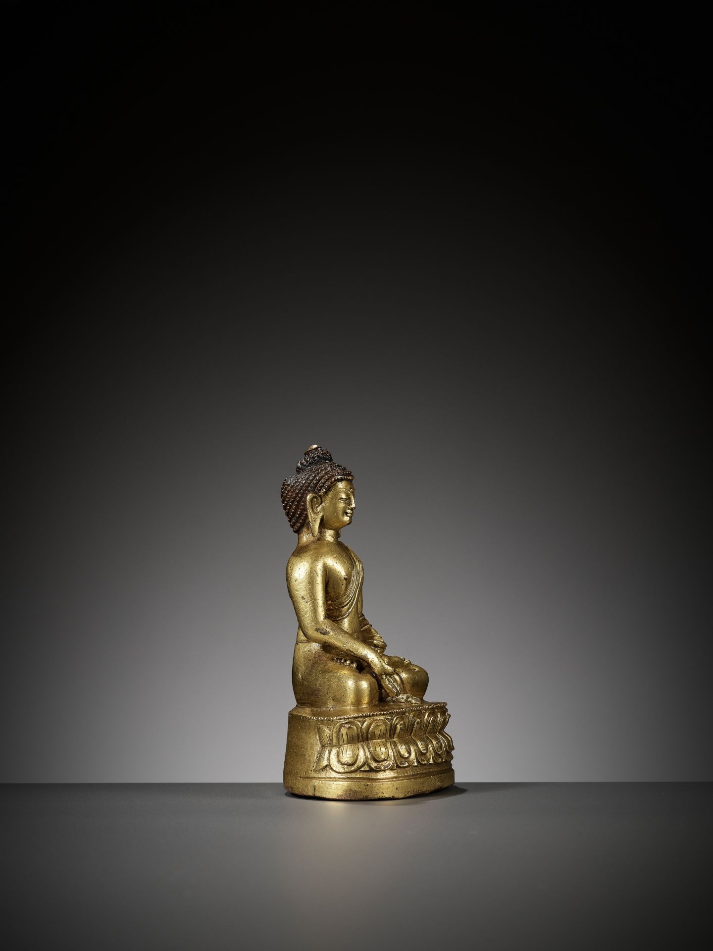 A GILT BRONZE FIGURE OF RATNASAMBHAVA, TIBET, 18TH CENTURY - Image 7 of 10