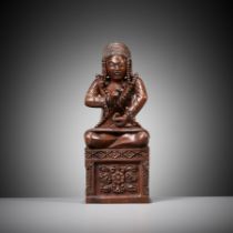 A MASTERFULLY CARVED HARDWOOD FIGURE OF A BUDDHIST PRIEST, SCHOOL OF CHOYING DORJE