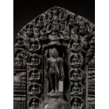 A BLACK STONE STELE OF NEMINATHA, THE 22ND JAIN TIRTHANKARA