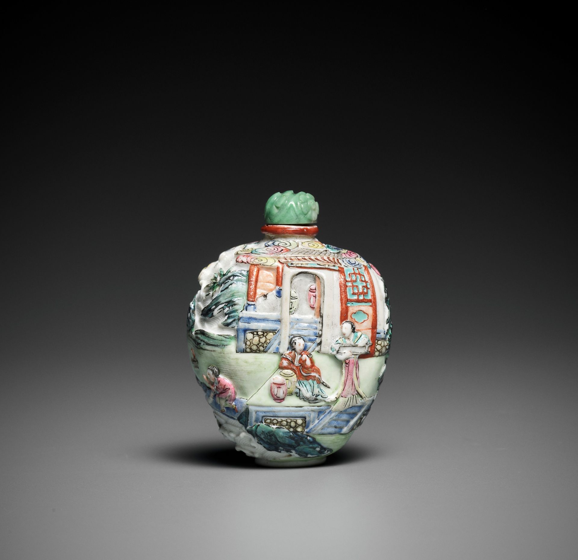 AN IMPERIAL MOLDED AND ENAMELED PORCELAIN SNUFF BOTTLE, JIAQING MARK AND PERIOD