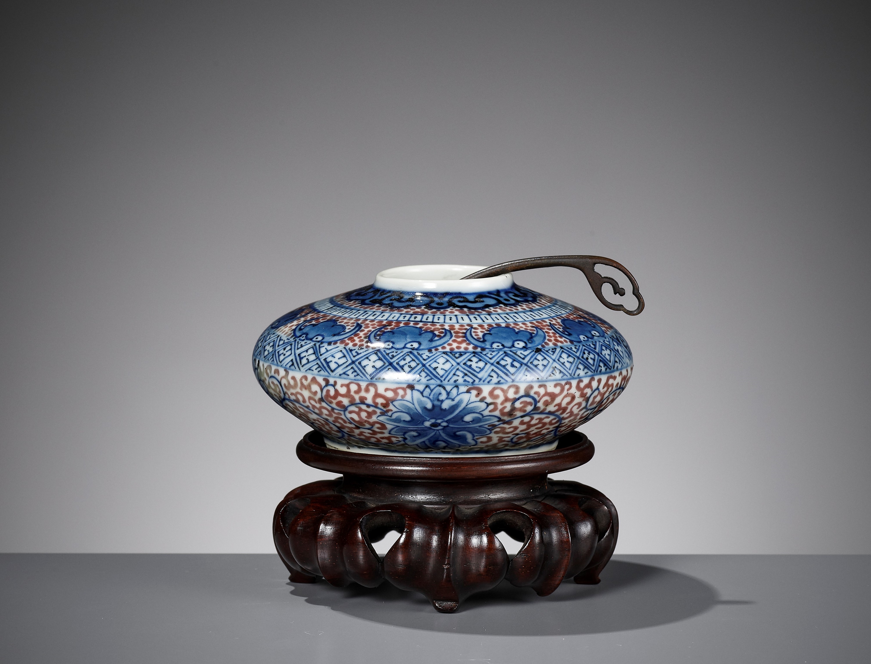 A PORCELAIN WATER POT, WITH MATCHING BRONZE SPOON AND WOOD STAND, QING DYNASTY