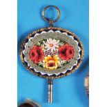 Mosaic pocket watch key in gilt setting, oval plate with colourful mosaic with floral decoration, It