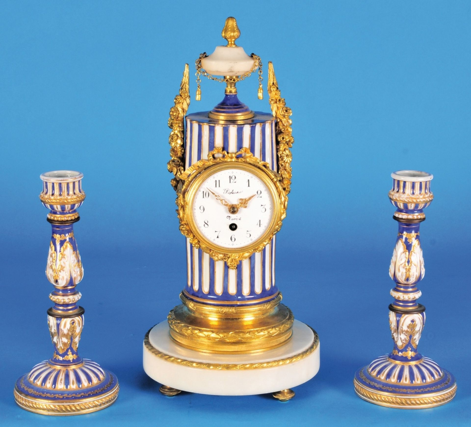 French porcelain clock set in the shape of a Column with two porcelain candlesticks