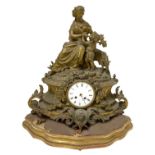 Table clock in bronze with gold patina, nineteenth century