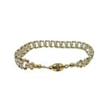 Bracelet in yellow gold and pearl processing