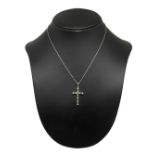 White gold necklace and cross with emeralds and diamonds